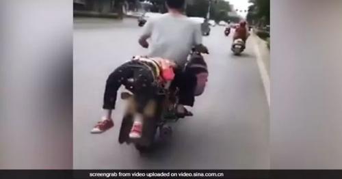 This Chinese cruel father ties his daughter onto bike, After she refused to go to school