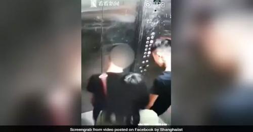 China: Two men pee in elevator as woman tries to block camera 