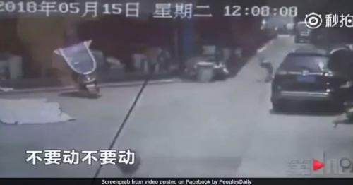 Video: Man Runs To Catch Girl Falling From 2 Storey Building In China